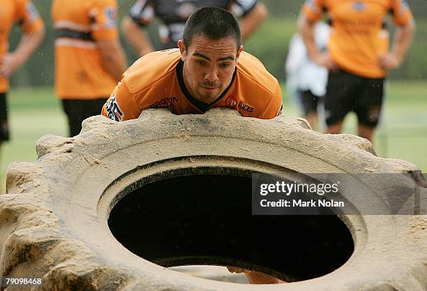 Dene Halatau lifts a truck tyre during the Wests Tigers Strongman Challenge held at Concord Oval January 18, 2008 in Sydney, Australia.