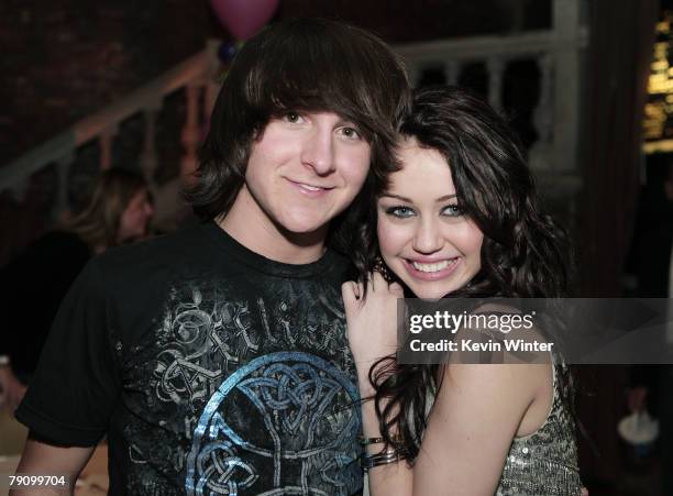 Actor Mitchel Musso and actress/singer Miley Cyrus pose at the afterparty for the premiere of Walt Disney Pictures' "Hannah Montana & Miley Cyrus:...