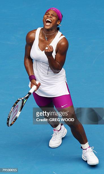Tennis player Serena Williams gestures as she celebrates victory in her womens singles match against Belarus opponent Victoria Azarenka at the...