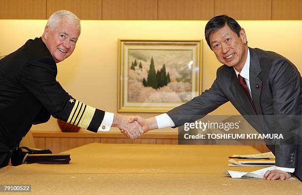 Pacific Fleet commander Admiral Timothy Keating shakes hands with Japanese Foreign Minister Masahiko Komura prior to their talks at the foreign...