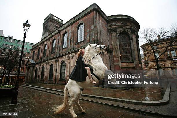 Stunt rider Emily Cox rides her horse Legend through St Ann's Square recreating the historical ride of Lady Godiva on January 18, 2008 in Manchester,...