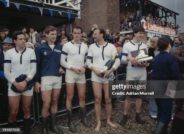 Michael Evans and Boris Rankov of the University of Oxford boat with other crew members celebrate their victory against the University of Cambridge...