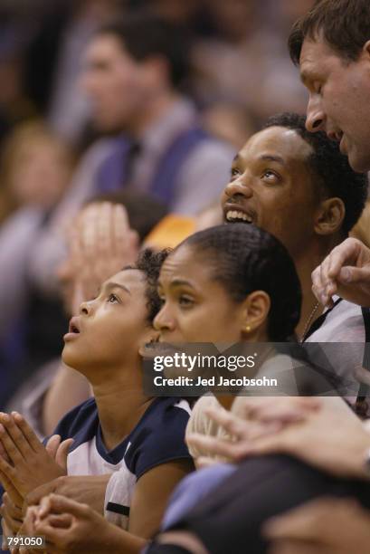 Actor Will Smith, son Tre and wife Jada watch Game six of the Western Conference Finals during the 2002 NBA Playoffs between the Sacramento Kings and...