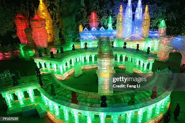 Visitors view ice sculptures at Yanqing Ice Festival on January 18, 2008 in Beijing, China. The Ice Lantern Show in Longqing Canyon, with the theme...