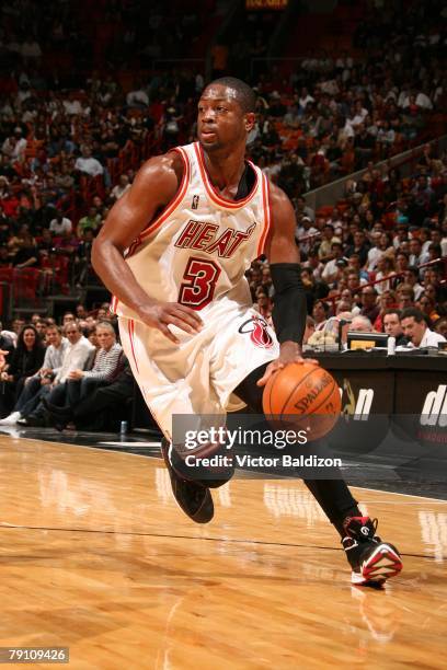 Dwyane Wade of the Miami Heat drives to the hoop against the Utah Jazz during the game on December 22, 2007 at American Airlines Arena in Miami,...