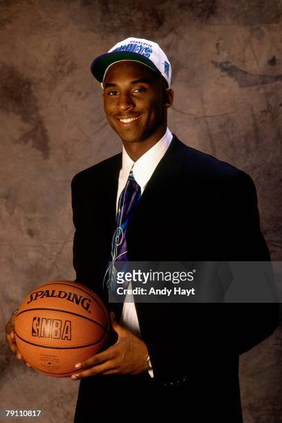 Kobe Bryant poses for a portrait after being selected by the Charlotte Hornets in the first round of the 1996 NBA Draft on June 26, 1996 at Madison...