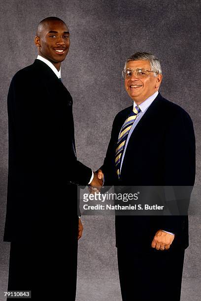 Kobe Bryant poses with NBA Commissioner David Stern after being selected in the first round of the 1996 NBA Draft on June 26, 1996 at Madison Square...