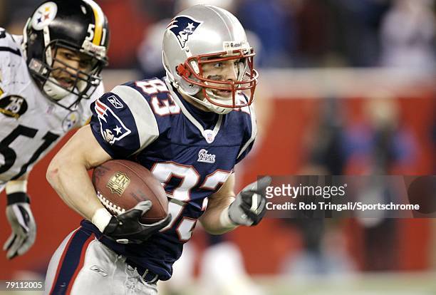 Wes Welker of the New England Patriots runs with the ball against the the Pittsburgh Steelers during their game on December 9, 2007 at Gillette...