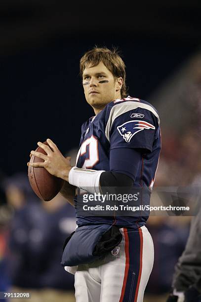 Tom Brady of the New England Patriots looks on from the bench during a game against the Pittsburgh Steelers during their game on December 9, 2007 at...