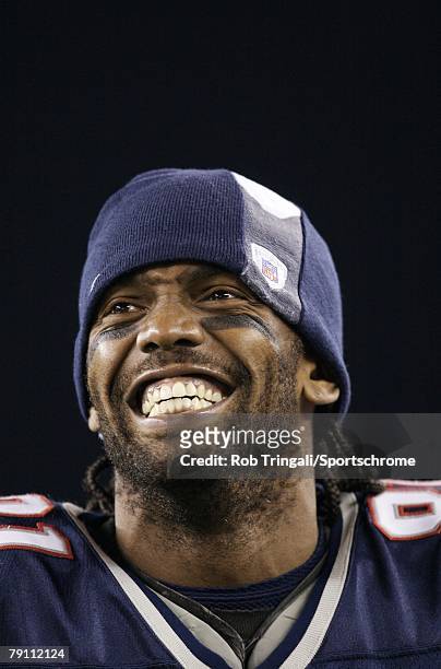 Randy Moss the New England Patriots laughs on the sidelines against the Pittsburgh Steelers during their game on December 9, 2007 at Gillette Stadium...