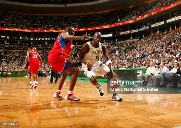 Kevin Garnett of the Boston Celtics dribbles against Reggie Evans of the Philadelphia 76ers on January 18, 2008 at the TD Banknorth Garden in Boston,...