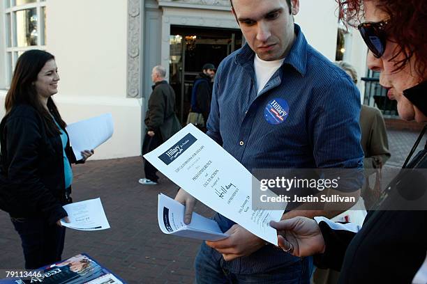 Hillary Clinton campaign volunteer Richard Lane of the United Kingdom passes out fliers for a Lesbian, Gay, Bi-Sexual and Transgendered march in...