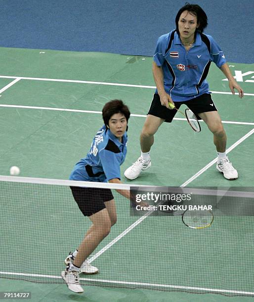 Thailand's mixed doubles pair Sudket Prapakamol and Saralee Thoungthongkam return a shot against China's Yu Yang and He Hanbin during the semifinals...