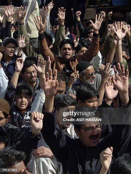 Pakistani Shiite Muslims shout anti-US slogans after offering prayers prior to the start of a religious procession in Karachi, 19 January 2008, on...