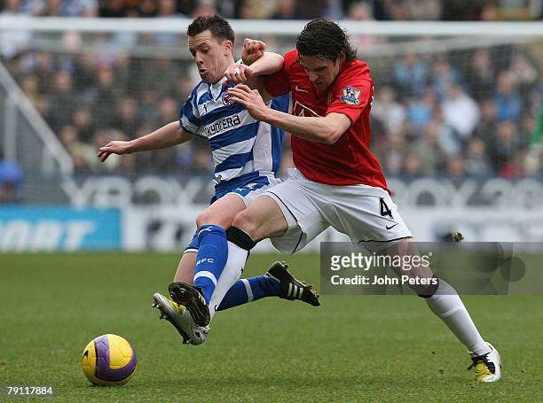 Owen Hargreaves of Manchester United clashes with Nicky Shorey of Reading during the Barclays FA Premier League match between Reading and Manchester...
