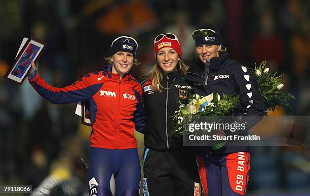 Ireen Wust of The Netherlands, Anni Friesinger of Germany and Marianne Timmer of The Netherlands after the ladies 1000m race during the first day of...