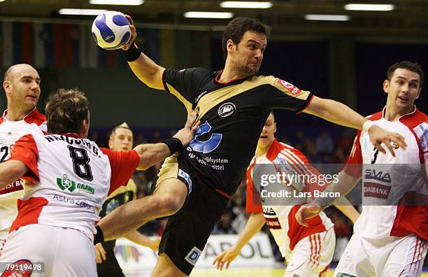 Markus Baur of Germany in action with Gergo Ivancsik and Ferenc Ilyes of Hungary during the Men's Handball European Championship Group C match...