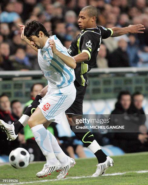 Marseille's forward Juan Angel Krupoviesa vies with Valenciennes' defender Juan Audel during the French L1 football match Marseille vs Valenciennes...