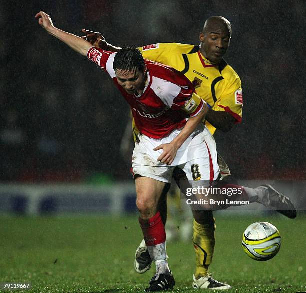 Matt Holland of Charlton Athletic is tackled by of Damien Francis of Watford during the Coca-Cola Championship match between Watford and Charlton...