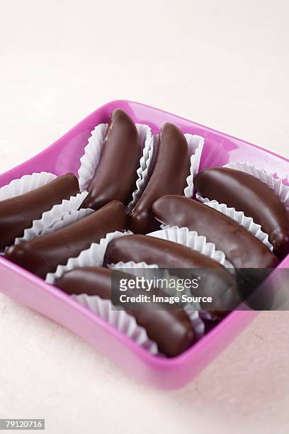chocolate covered marzipan bananas - schokobanane stock-fotos und bilder