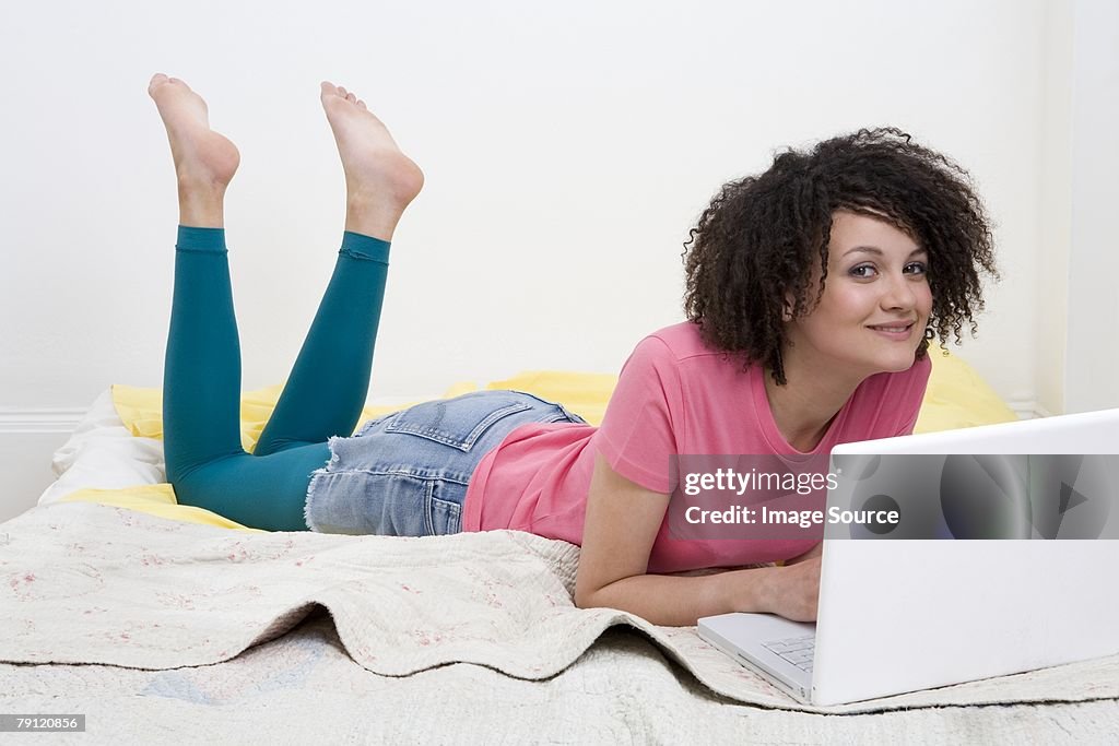 Teenage girl using laptop