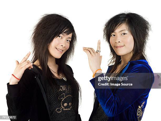 twin sisters - identical twin stock pictures, royalty-free photos & images
