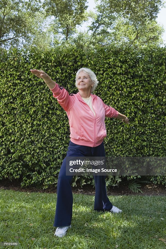 Woman exercising in garden