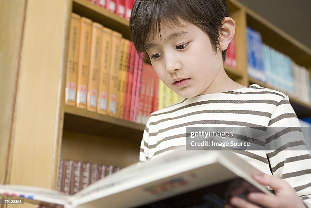 Boy reading a book