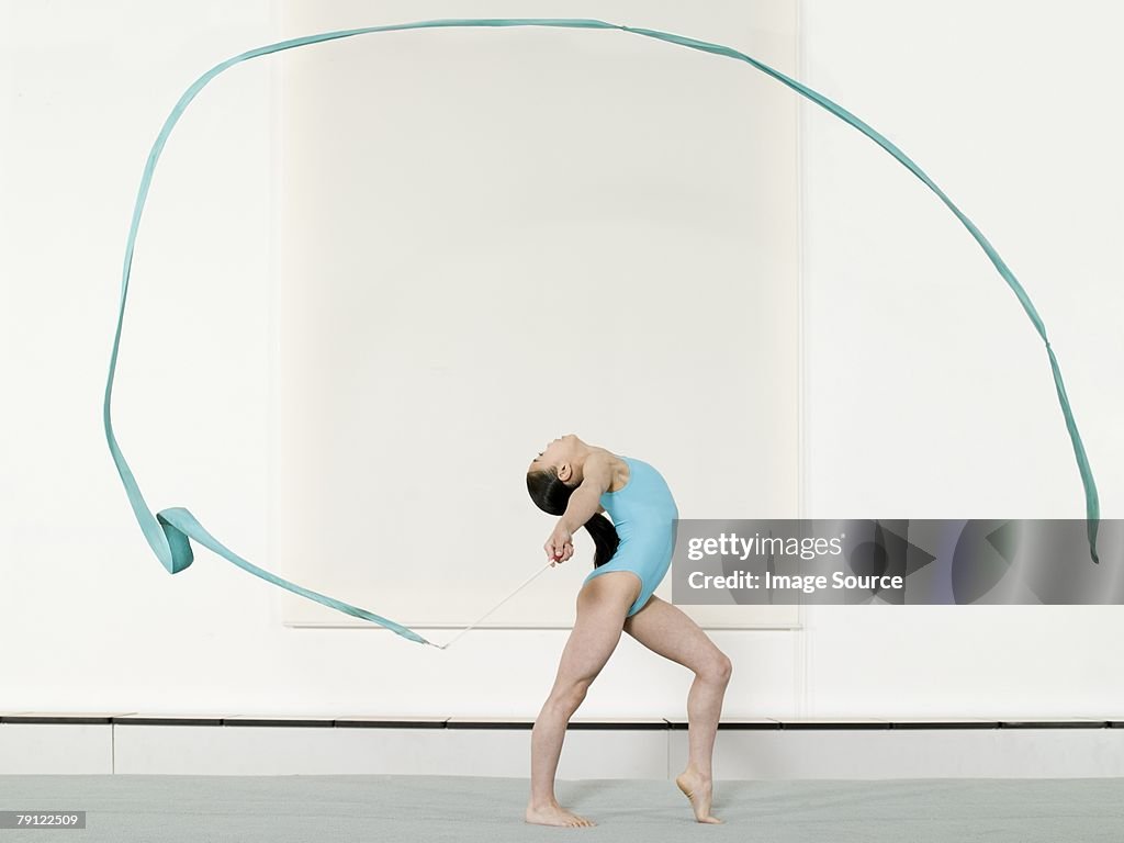 Girl doing rhythmic gymnastics