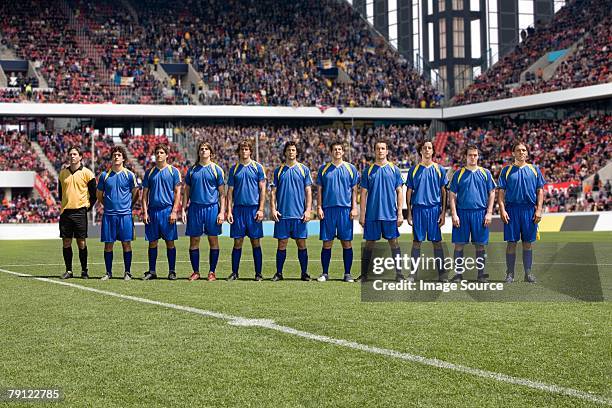 footballers in a row - football team stock pictures, royalty-free photos & images