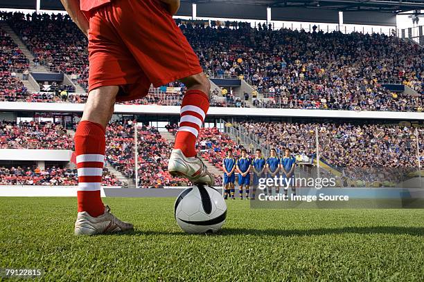 footballer about to take a free kick - football free kick stock pictures, royalty-free photos & images
