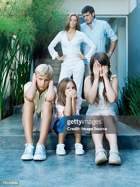 parents annoyed at children - hear no evil stock pictures, royalty-free photos & images