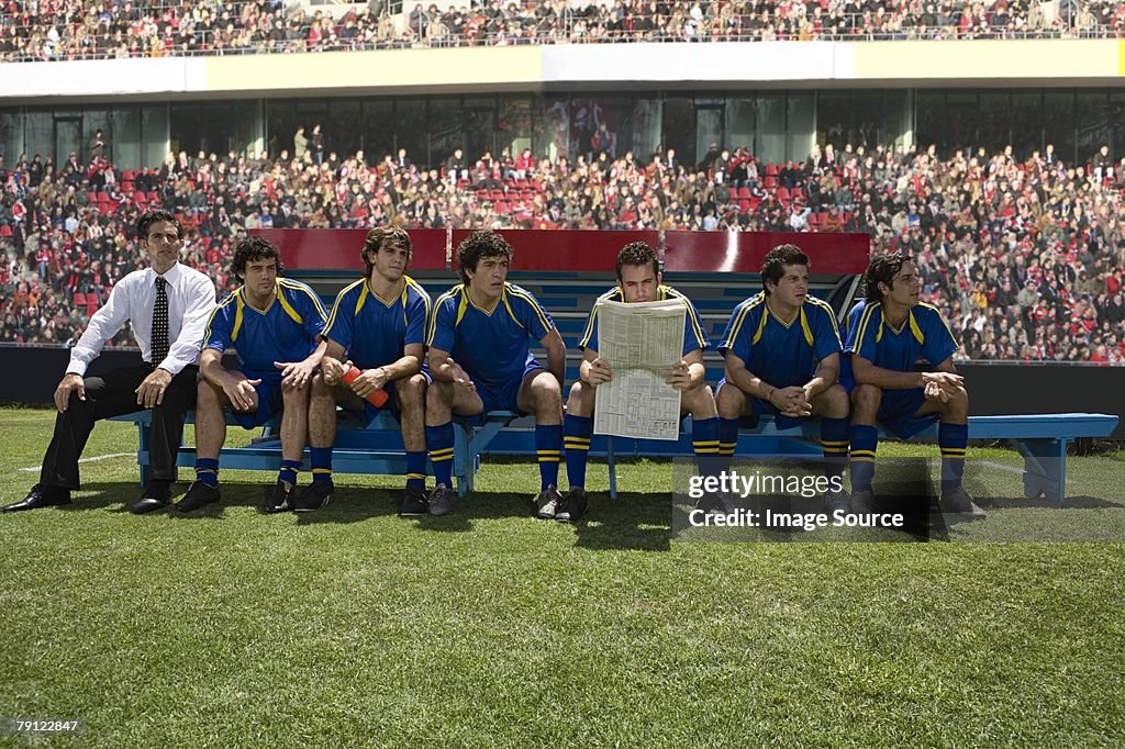 Footballer reading a newspaper