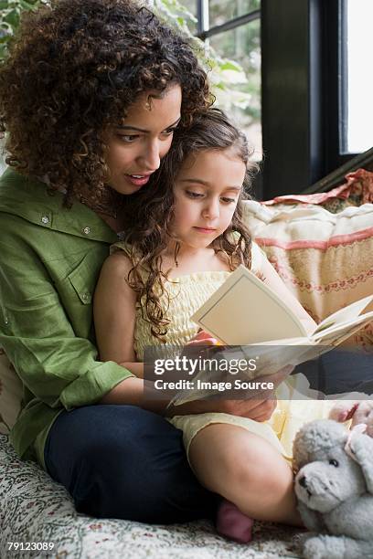 mother and daughter reading - children reading stock pictures, royalty-free photos & images