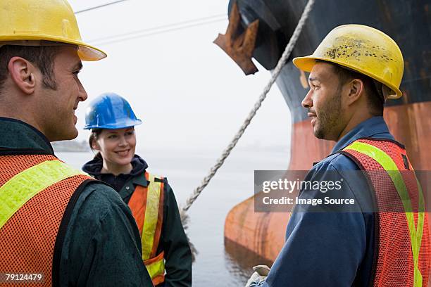 colleagues by ship - shipyard stock pictures, royalty-free photos & images