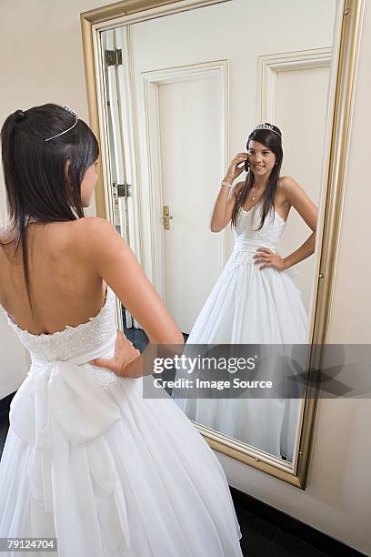 quinceanera looking in mirror - quinceanera party stock pictures, royalty-free photos & images