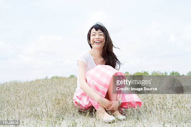 happy young woman - skirt blowing stock pictures, royalty-free photos & images
