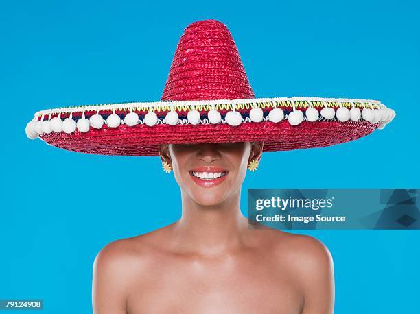 woman wearing a sombrero - sombrero hat stock pictures, royalty-free photos & images