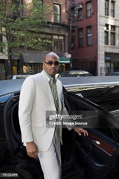 man getting out of limousine - best sunglasses for bald men stock pictures, royalty-free photos & images