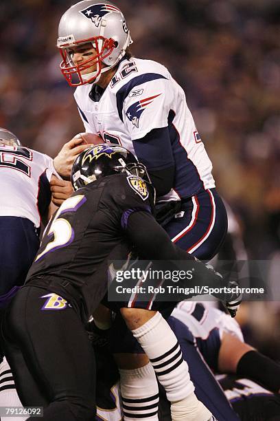 Tom Brady of the New England Patriots gets tackled by Terrell Suggs of the Baltimore Ravens on December 3, 2007 at M&T Bank Stadium in Baltimore,...