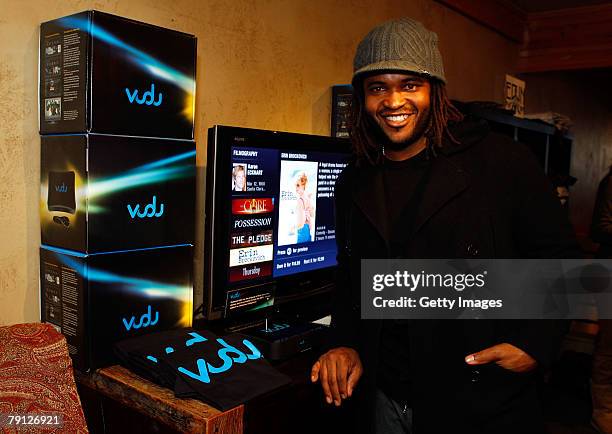 Executive producer Sal Masekela poses with the Vudu display at the Gibson Guitar celebrity hospitality lounge held at the Miners Club during the 2008...