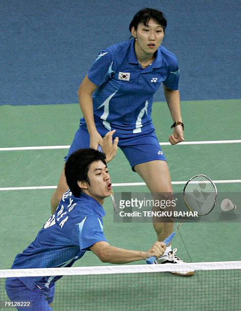 South Korea's mixed doubles pair Lee Yong Dae and Lee Hyo Jung return a shot against China's Yu Yang and He Hanbin during their mixed doubles finals...