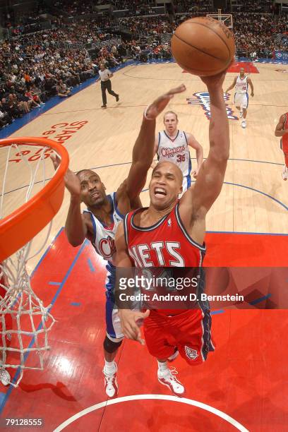 Richard Jefferson of the New Jersey Nets goes up for a dunk against Quinton Ross of the Los Angeles Clippers at Staples Center on January 19, 2008 in...