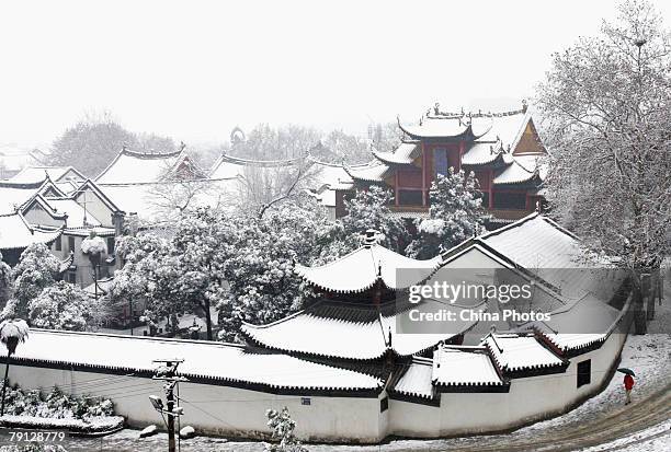The elevated view of the snow-covered Guiyuan Ancient Temple is seen after the second snowfall of this week, the heaviest snowfalls that have been...