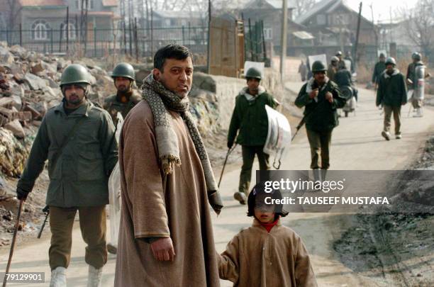 Members of the Indian Central Reserve Police Force patrol downtown after overnight sectarian clashes in Srinagar, 20 January 2008. Indian police used...