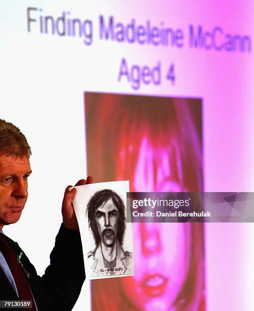 McCann family spokesman Clarence Mitchell holds an artist's impression of the new suspect on January 20, 2008 in London, England. The description has...