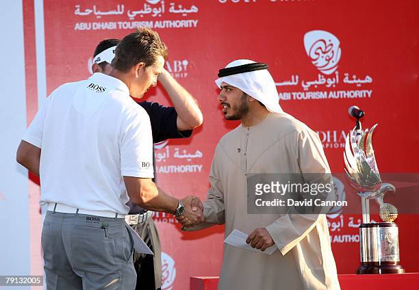 Henrik of Stenson of Sweden is presented with the second prize by His Highness Sultan Bin Tahnoon Al Nahyan the Chariman of the Abu Dhabi Tourism...