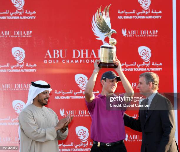 Martin Kaymer of Germany is presented with the trophy by His Highness Sultan Bin Tahnoon Al Nahyan the Chariman of the Abu Dhabi Tourism Authority...