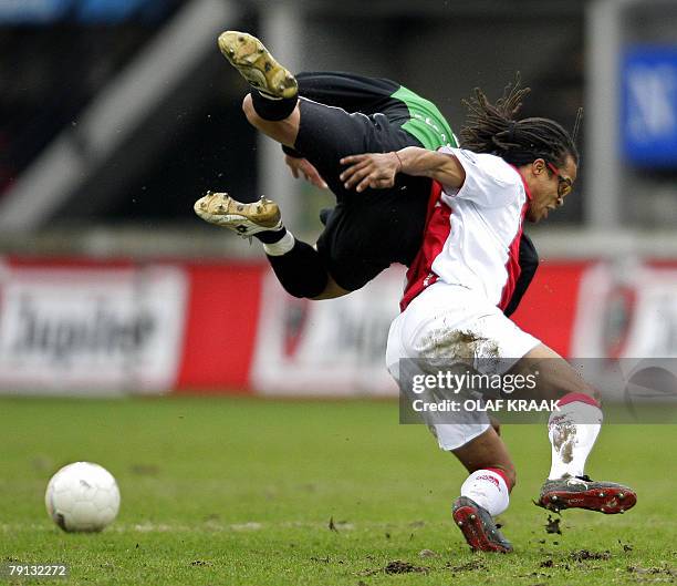 Ajax 's Edgar Davids in duel with Youssef El-Akchaoui of NEC as part of the Netherlands First Division soccer match held in Nijmegen, 20 January...
