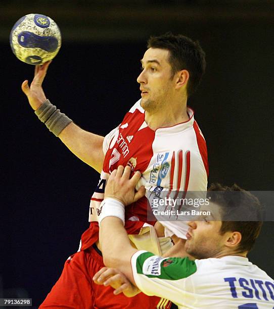 Ferenc Ilyes of Hungary in action with Aliaksandr Tsitou of Belarus the Men's Handball European Championship Group C match between Hungary and...